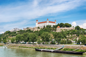 Obraz premium Bratislava, Slovakia - May 24, 2018: View of Bratislava castle which occupies a prominent location in the city overlooking the Danube river. 