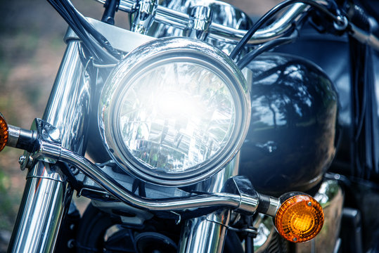 Fototapeta Motorcycle headlight close up, film blue tone style