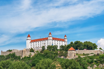 Naklejka premium Bratislava, Slovakia - May 24, 2018: View of Bratislava castle which occupies a prominent location in the city overlooking the Danube river. 