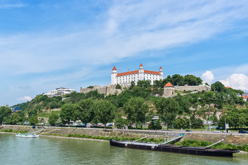 Fototapeta na wymiar Bratislava, Slovakia - May 24, 2018: View of Bratislava castle which occupies a prominent location in the city overlooking the Danube river. 