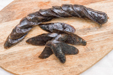 sausage on wood plate