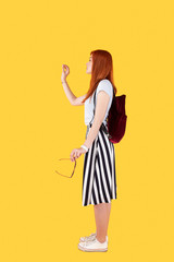 Young traveller. Attractive young woman looking in front of her while travelling