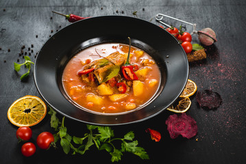 Hungarian soup bograch on black background