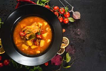 Hungarian soup bograch on black background