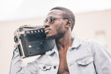 African man with vintage radio device.