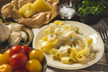 Alfredo Pasta Plate with Creamy Cheese and Basil Sauce