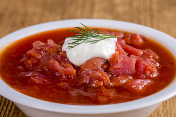 Vegetable soup - red borsch, closeup. Healthy beetroot soup, vegetarian food. Ukrainian and russian national food - red beet soup, borscht