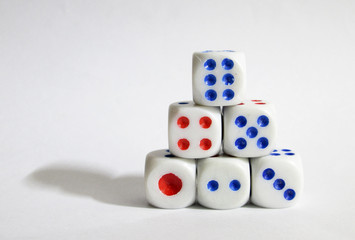 Dice game puzzle. Plastic dice pile as game