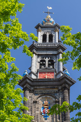 Fototapeta na wymiar Amsterdam Church in the summer with clock and crown