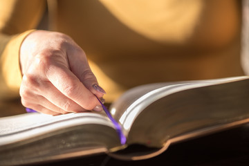 Woman reading the bible, hard light