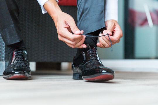 Man tying his shoelaces