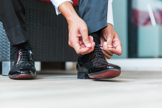 Man tying his shoelaces