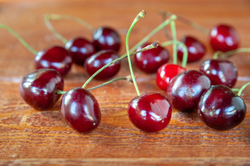 Sweet cherry on a wooden background