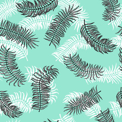 Seamless tropical pattern. Palm leaves on the blue background