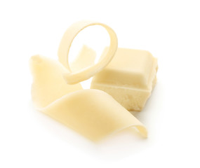 Piece of chocolate and curl on white background