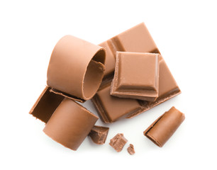 Pieces of chocolate and curls on white background