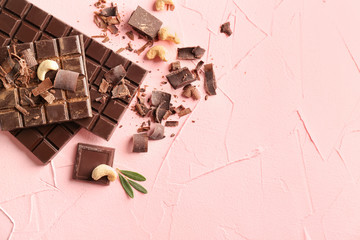 Tasty chocolate on color background