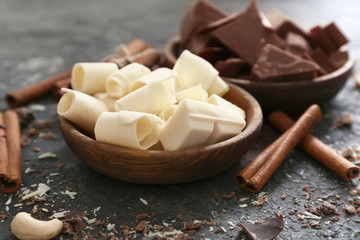 Bowl with tasty chocolate on table