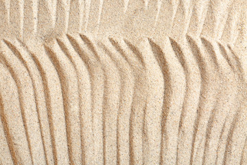 Fototapeta na wymiar Sand with pattern, closeup