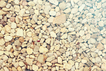 Light pabble stone wallpaper background with yellowish accent, summer rays like, retro look