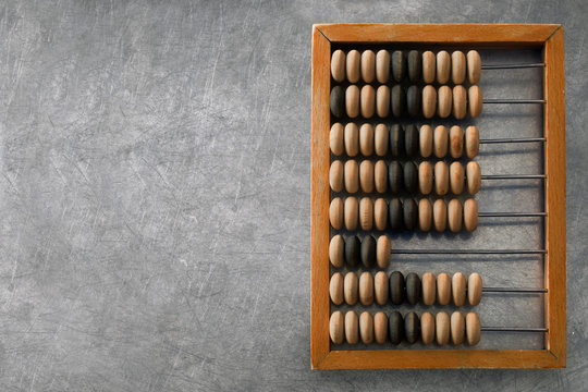 wooden abacus on a metal surface