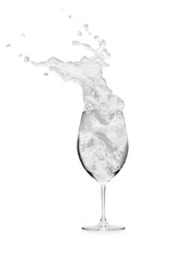 glass with water splashing isolated on a white background.