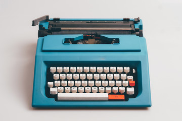 Close up typewriter on white background.