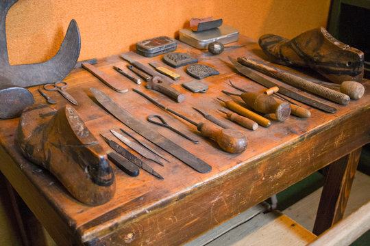 A shoemaker's work table with its tools displayed in good order