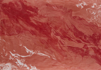 Fototapeta premium Natural bordoux plaster background with abstract pattern, close-up, macro.