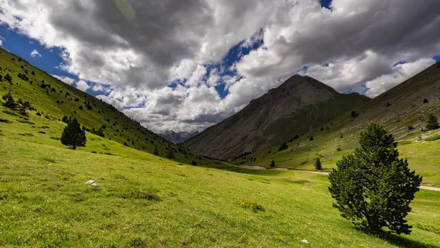 Col du Noyer looking towards Devoluy in Summer with passing clouds (time-lapse). Hautes-Alpes, Alps, France