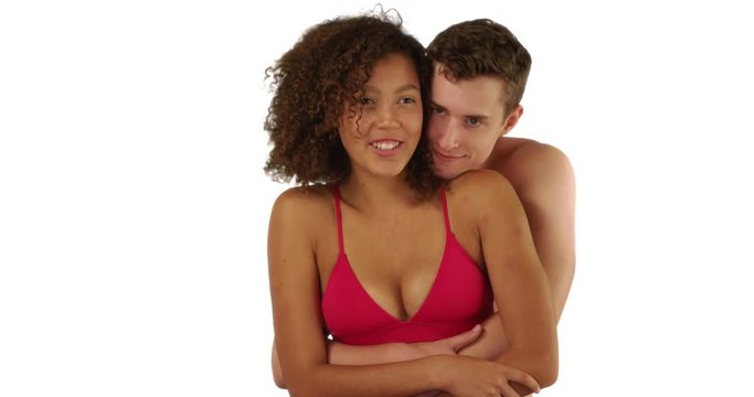 Affectionate young couple enjoying day at the beach on white background with copyspace, Caucasian male embraces his cute girlfriend in studio with copy space, 4k