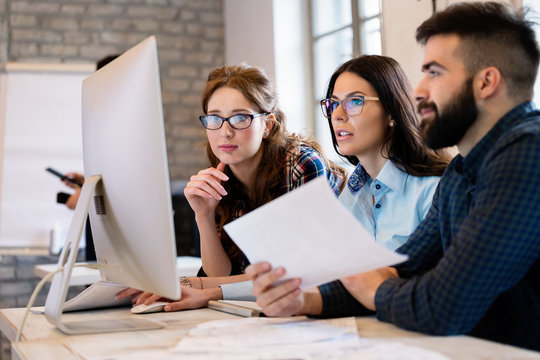 Young architects working on project in office