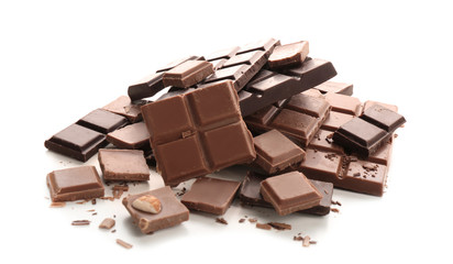 Pieces of tasty milk and dark chocolate on white background