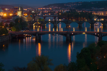 Fototapeta na wymiar Night landscape with bridges. Prague, Czech Republic