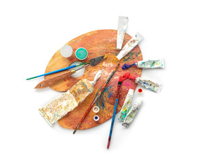 Tools with paint palette on white background
