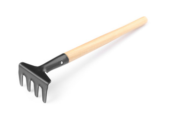 Metal rake for gardening on white background
