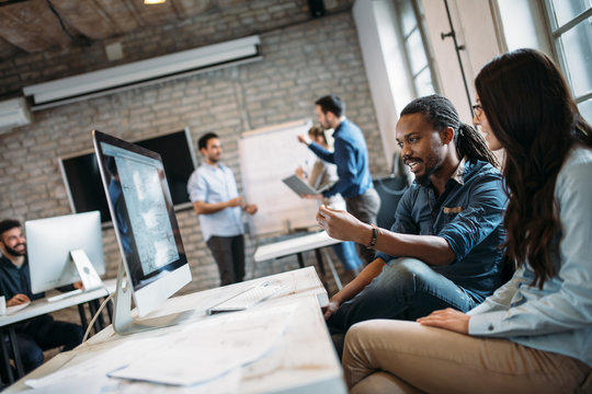 Young architects working on project in office