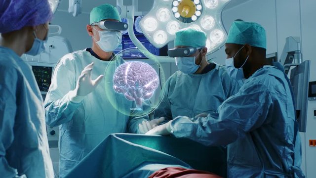 Surgeons Wearing Augmented Reality Glasses Perform Brain Surgery with Help of Animated 3D Brain Model, Using Gestures. Futuristic Theme. Shot on RED EPIC-W 8K.