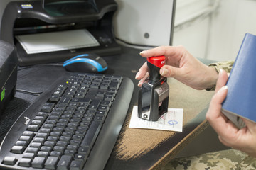 Ukrainian passport. Border Control check in. The process of stamping of passport document while...