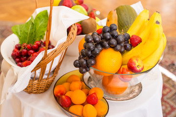 Decoration with ripe delicious fruits on white table