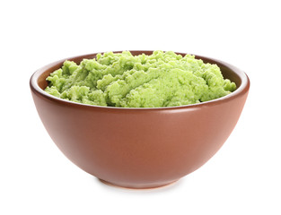 Bowl with delicious guacamole on white background