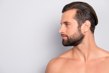 Profile side view half-faced portrait with copy space of handsome, muscular, athletic, confident, sporty, naked guy with perfect, ideal skin, isolated on gray background