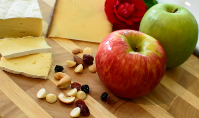 Apple and Cheese plate Healthy Snack Still Life with Nuts and Berries