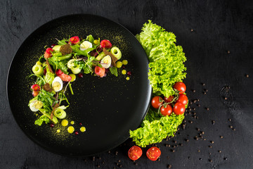 Fresh tasty salad dish with vegetables and herbs