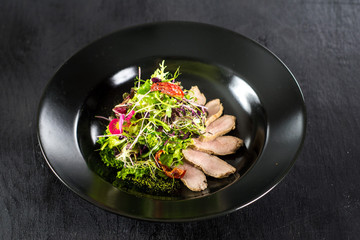 Fresh tasty salad dish with vegetables and herbs