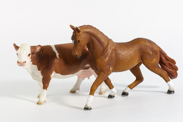 luxury baby rubber horse and cow toys for animal collection on white background.