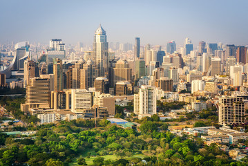 Obraz premium Bangkok city office buildings and condominium view from roof top bar on hotel, Bangkok, Thailand