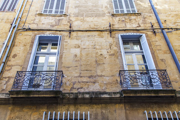 Aix-en-Provence, FRANCE,6 of March, 2018. The sun lights a facade of the old building with a...