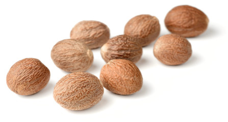 dried nutmeg isolated on white