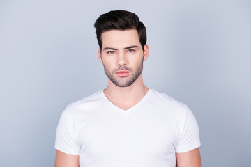 Obraz premium Portrait of perfect ideal man in white t-shirt with modern hairstyle soft smooth skin, isolated on grey background